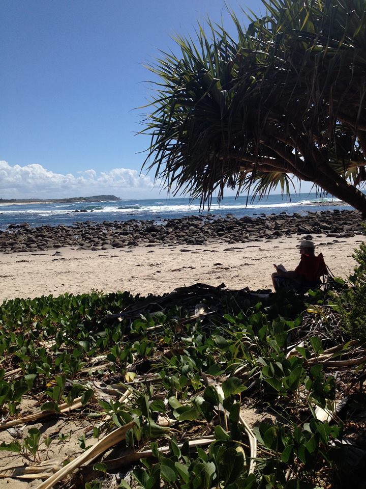 An old man enjoying some shade at Bluff's Beach