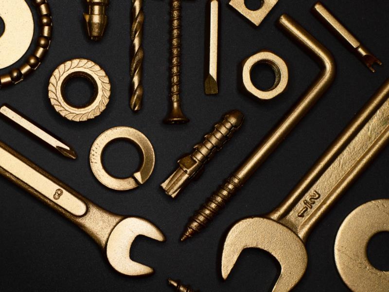 An assortment of wrenches, bolts, hex keys, and other tools.