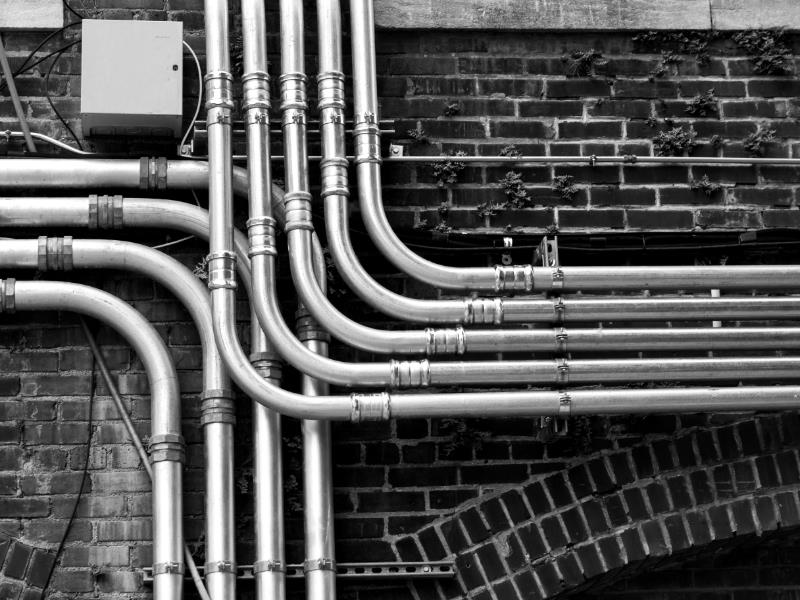 A set of pipes against a wall
